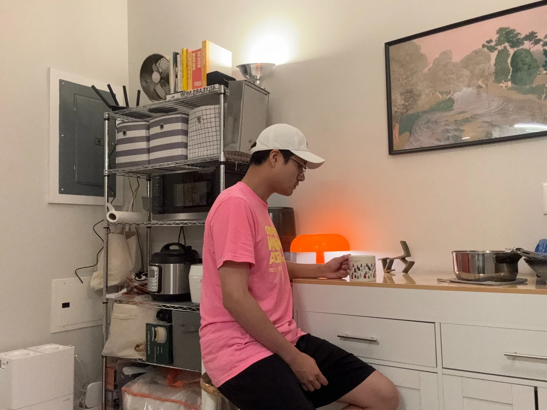 My original photograph, sitting alone with a mug in my apartment kitchen.