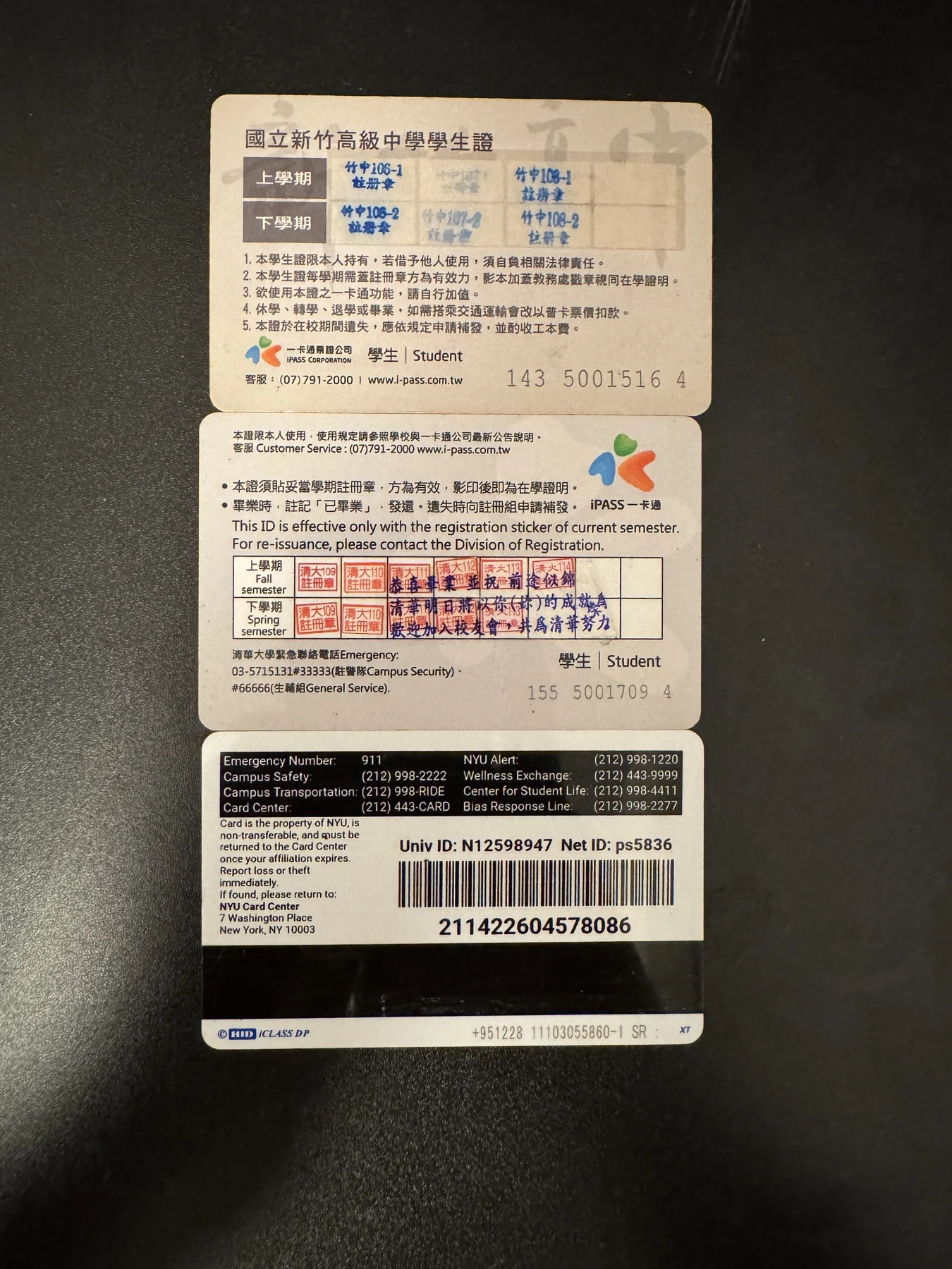 The reverse sides of my three student IDs arranged together
