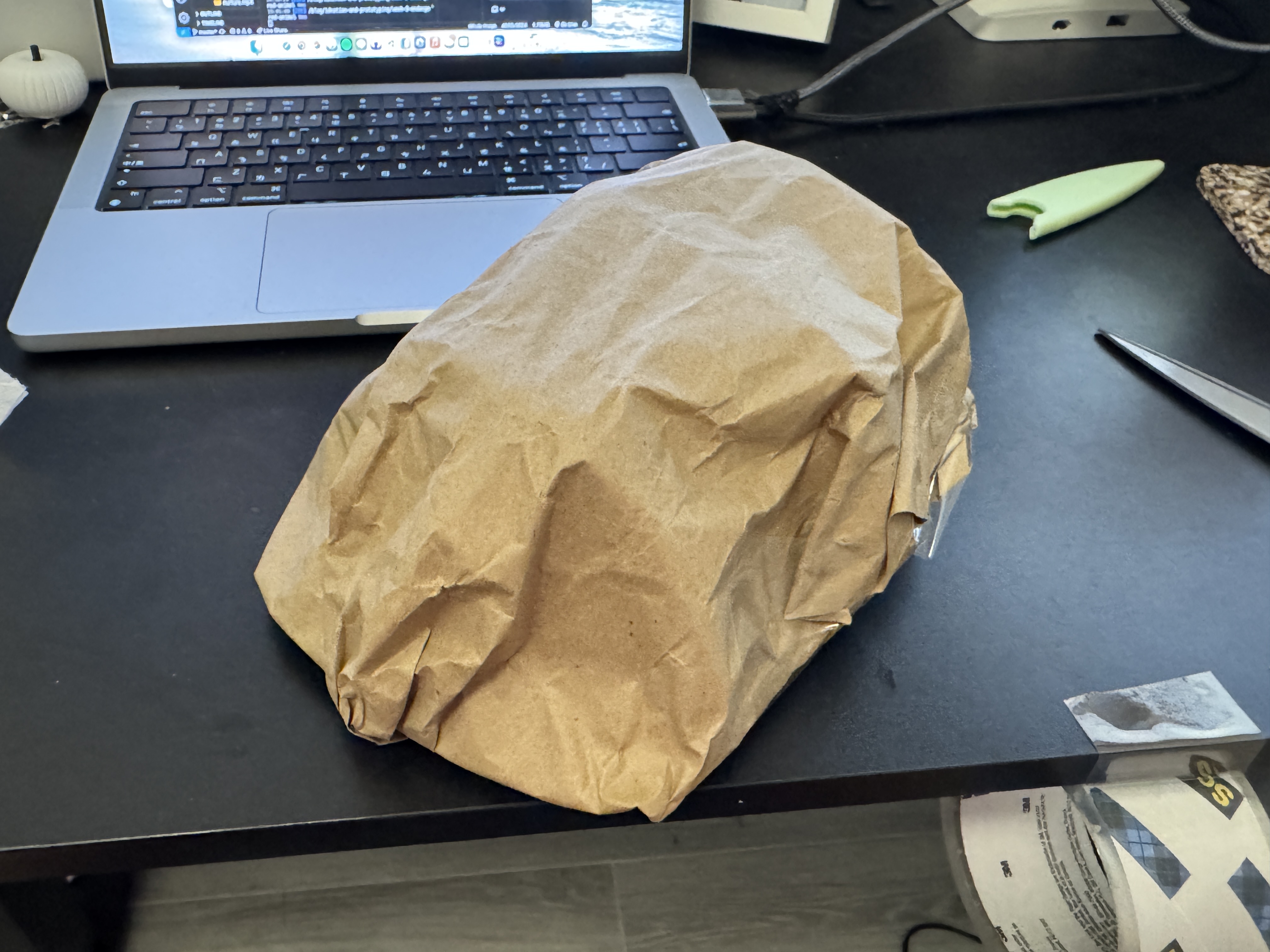 Cardboard shell structure fully covered with wrinkled brown paper.