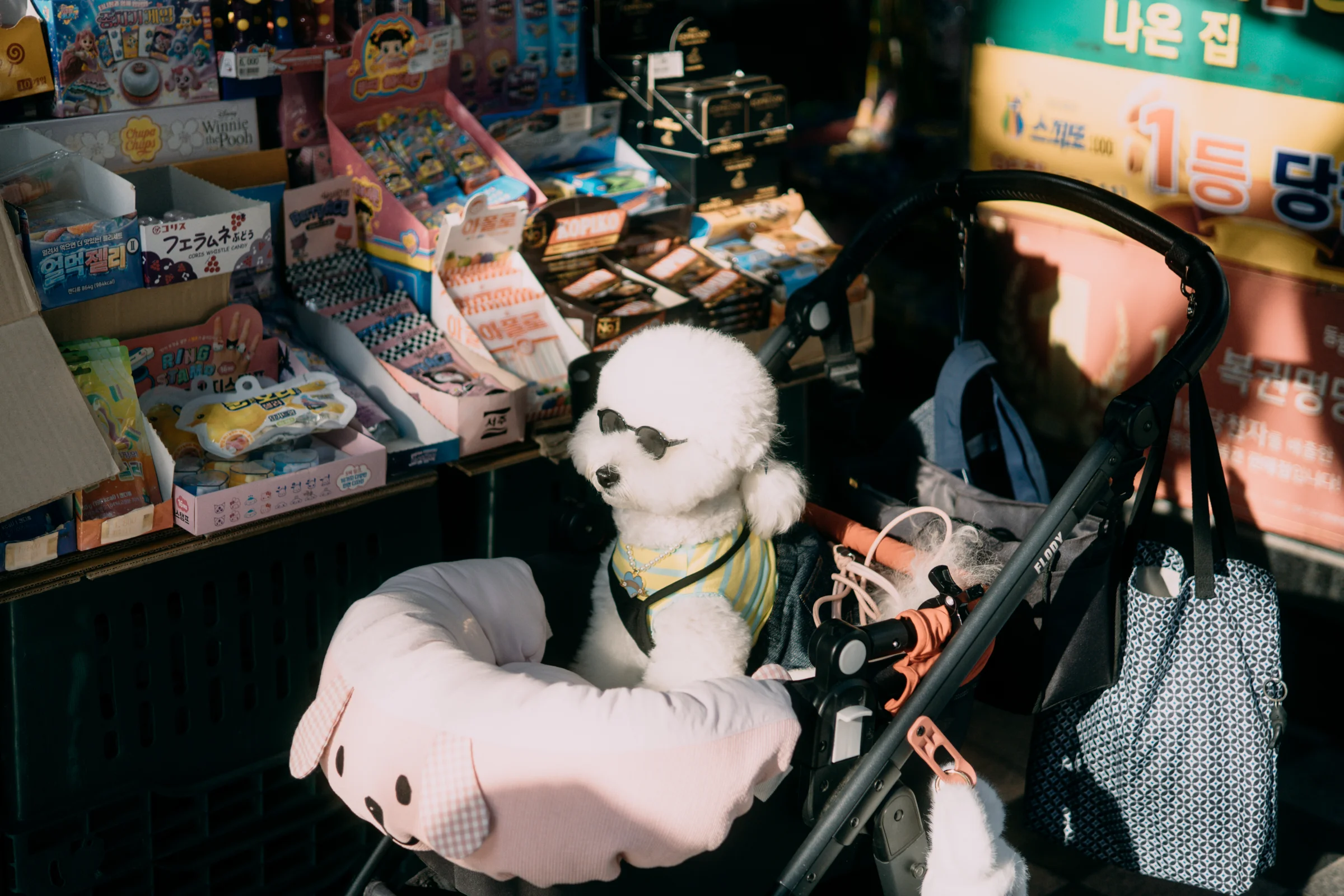 Plush toys and colorful souvenirs fill a crowded shop display.